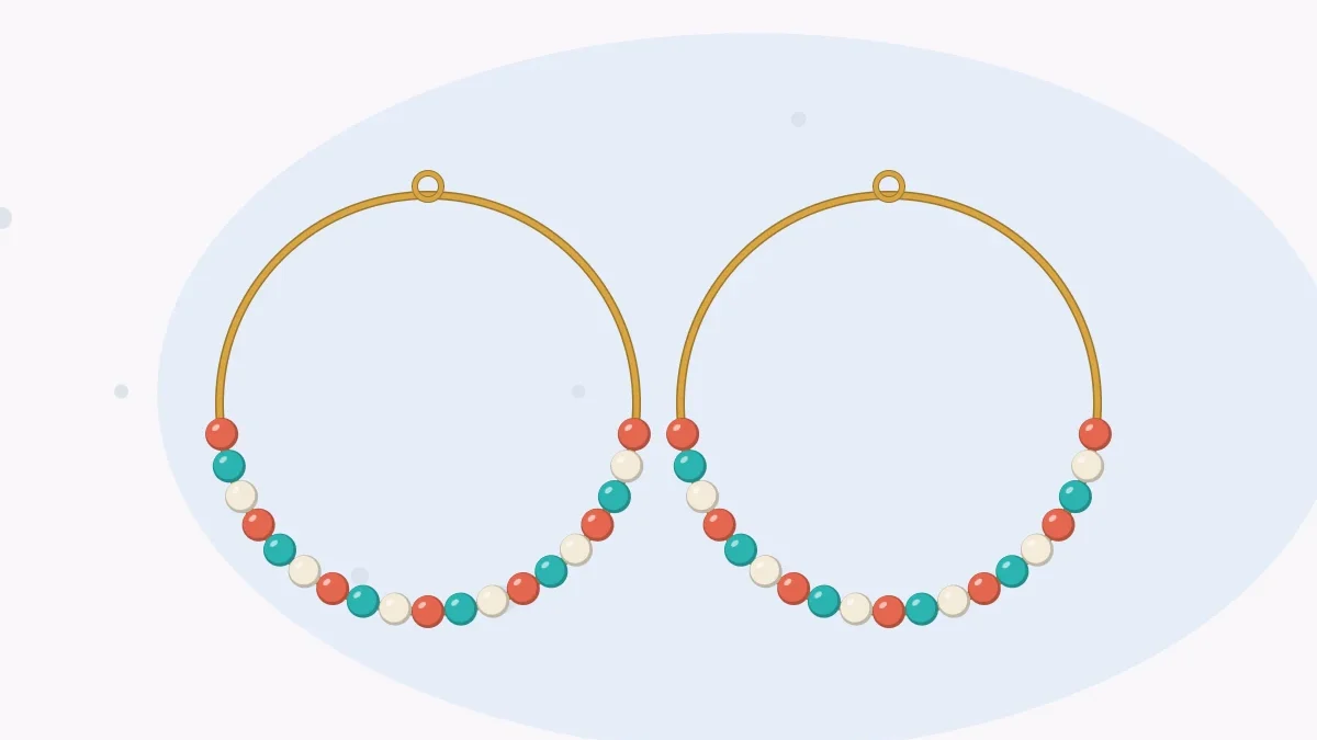 Illustration of a pair of wire hoop earrings with round beads along the lower half of each hoop